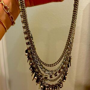 Gold and silver layered necklace with leather clasp